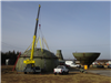 Crane getting ready to lift top of water tower