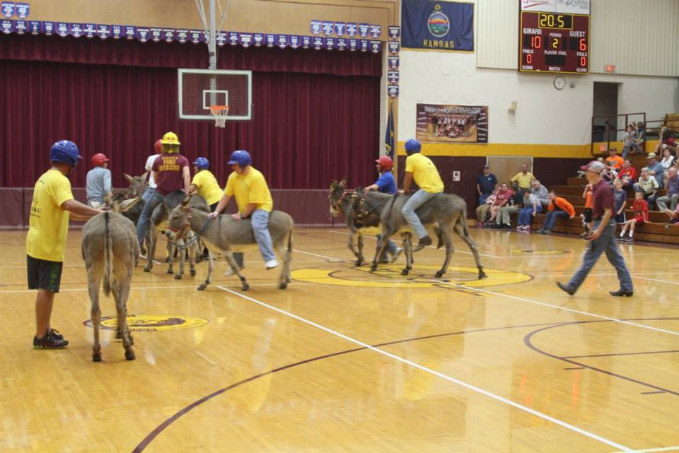 People riding donkeys during the donkey ball game