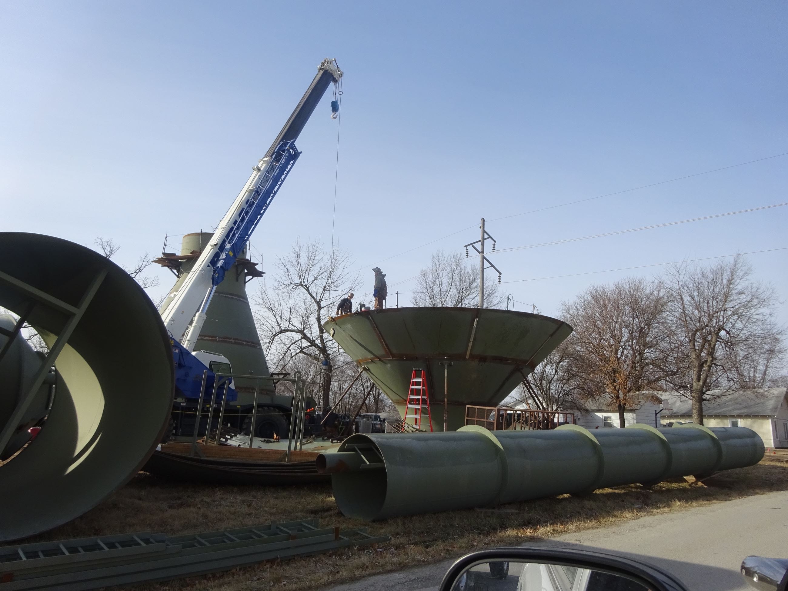 Crane being attached to a part of the East Water Tower