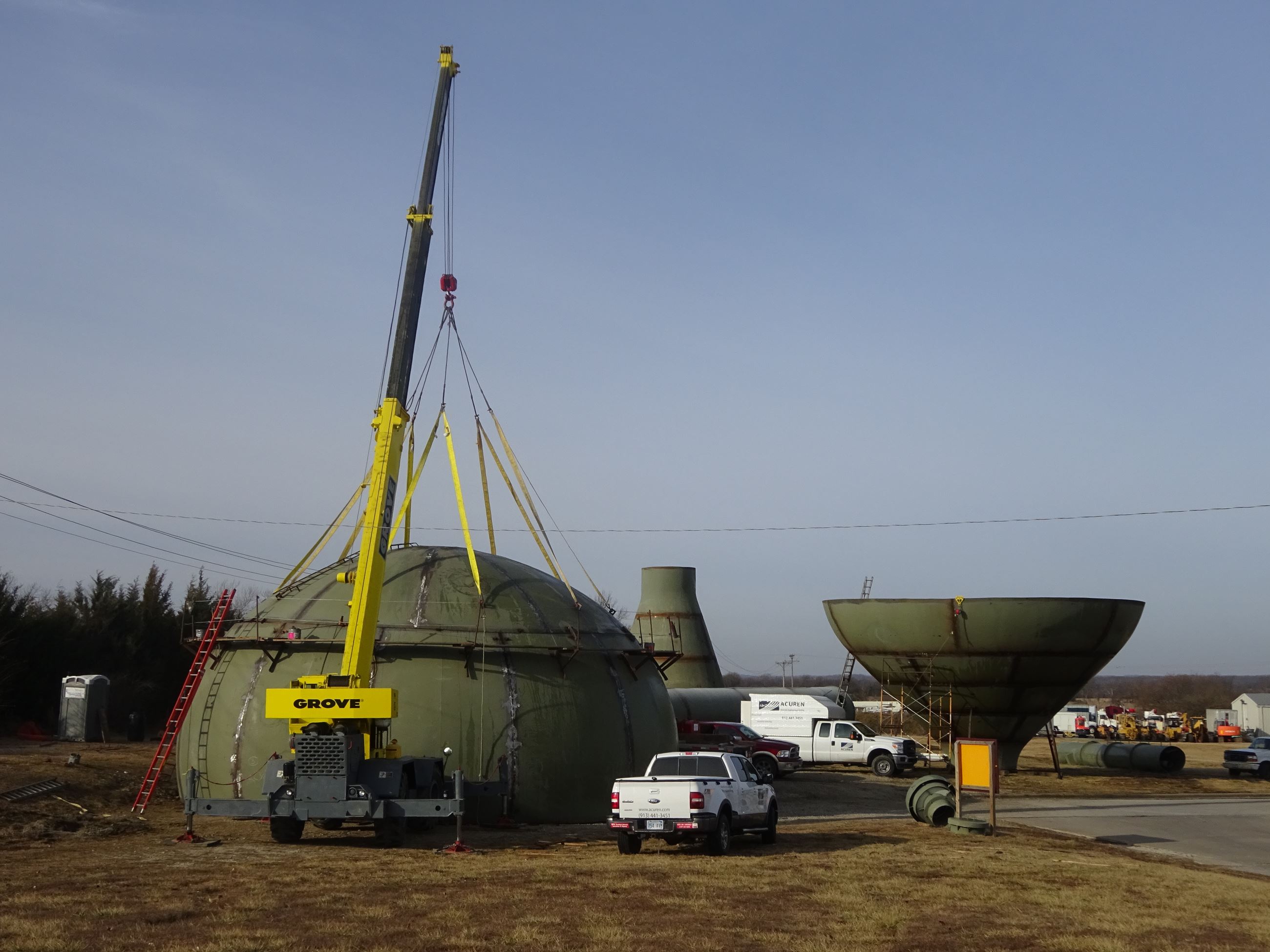 Crane getting ready to lift top of water tower